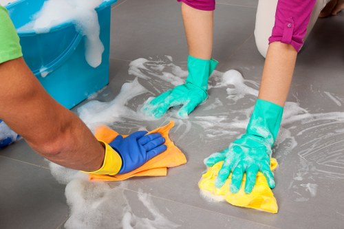 Local cleaning team carrying out post-build dust removal in a Westminster apartment