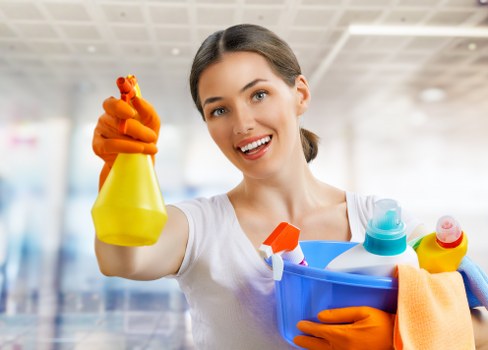 Cleaner carrying out a safe workplace assessment